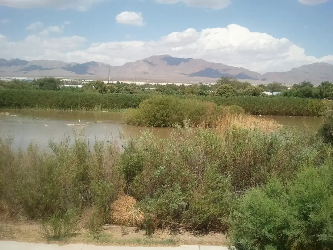 Rio Grande running through the El Paso Upper Valley near Canutillo TX with the mountains beyond